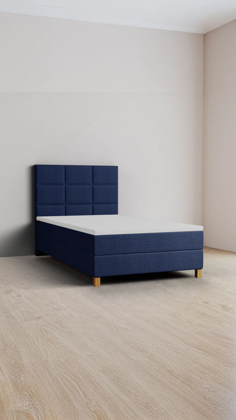 Mørkeblå enkeltseng med boxmadras 140x200 cm